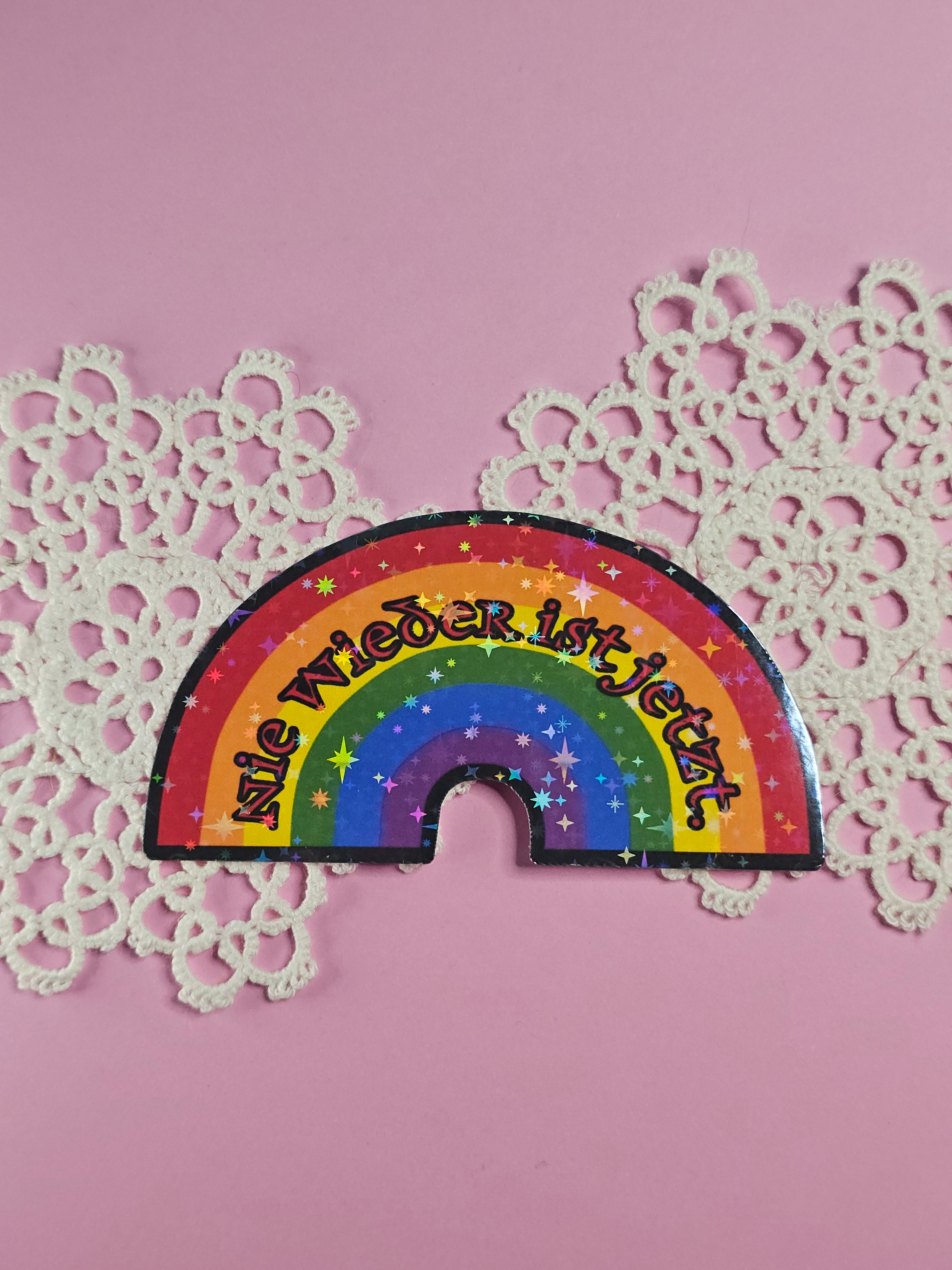 Single sticker - Rainbow "Never again is now"